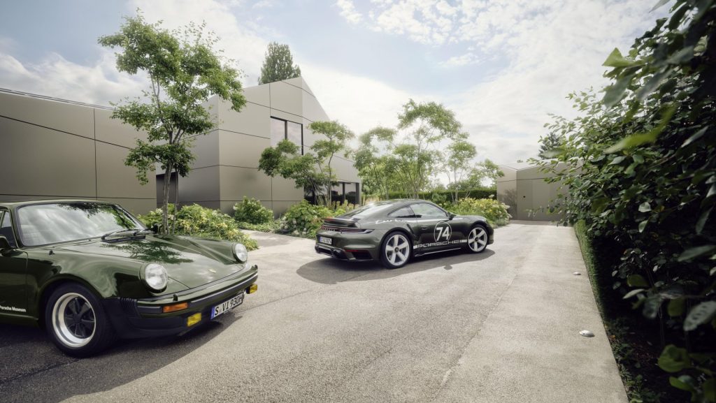 A 1975 Porsche 911 Turbo alongside the 2025 50th anniversary edition