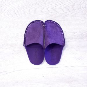 A pair of purple leather slippers for kids