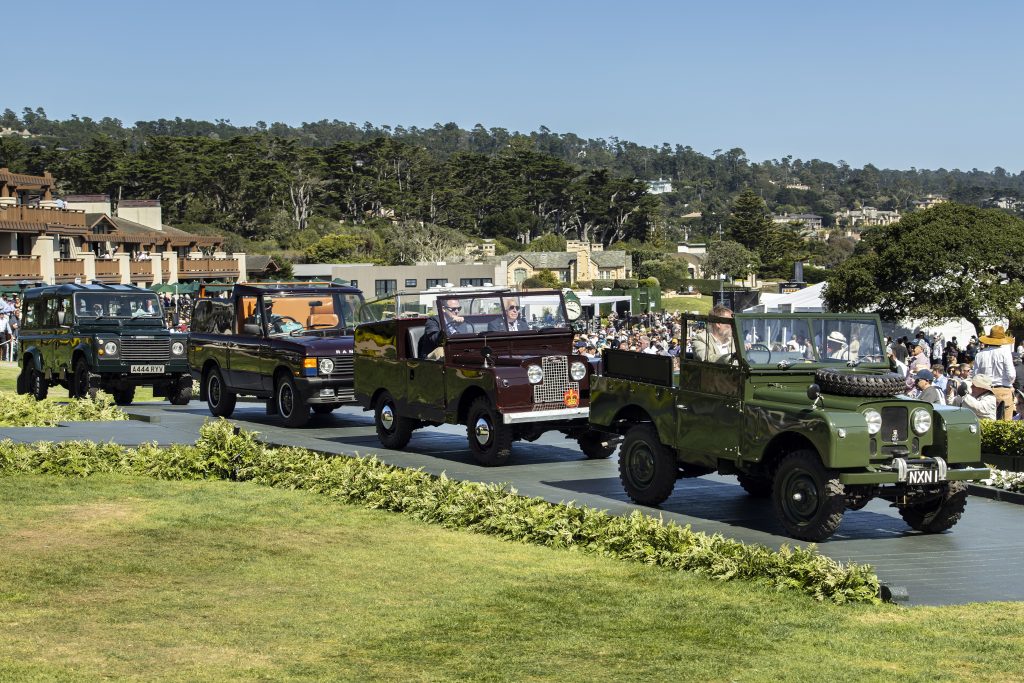 Several of Her Majesty Queen Elizabeth's vintage Land Rover and Range Rover State vehicles in a procession at Pebble Beach