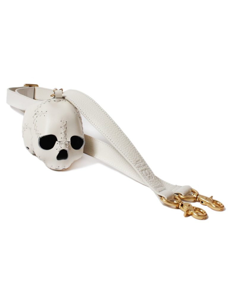 Small white hand-stitched leather skull with bag strap